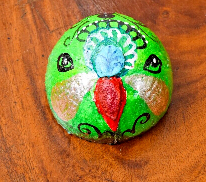 Coconut shells hand painted with different faces specified for hotel decorations