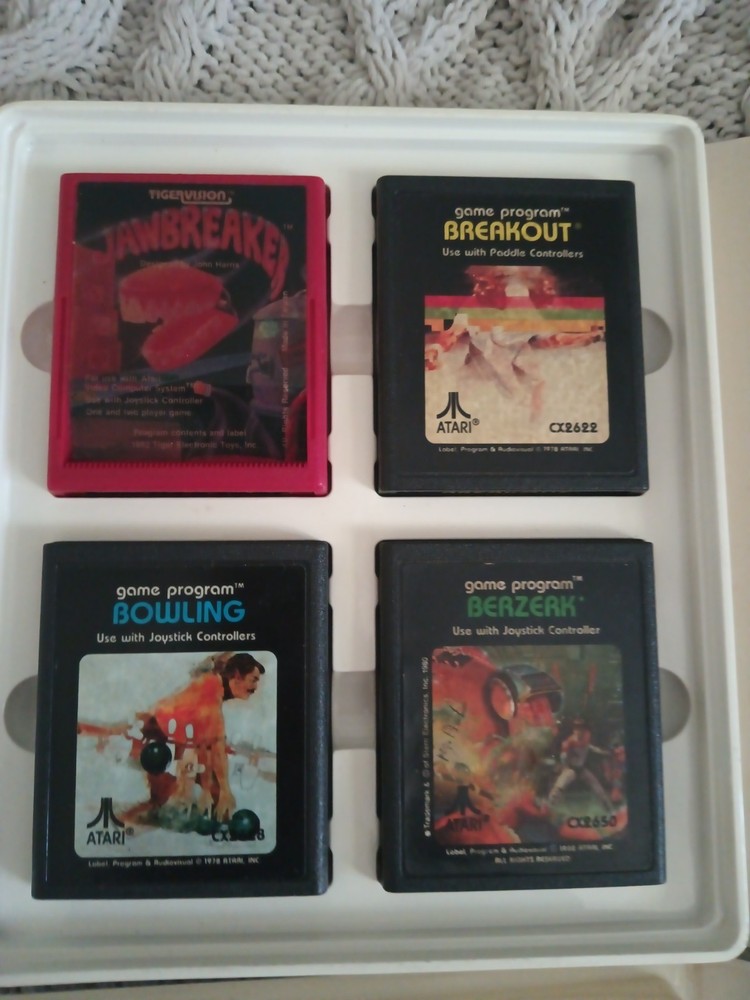 Vintage Atari 2600 Game lot with Atari Original storage cases, untested