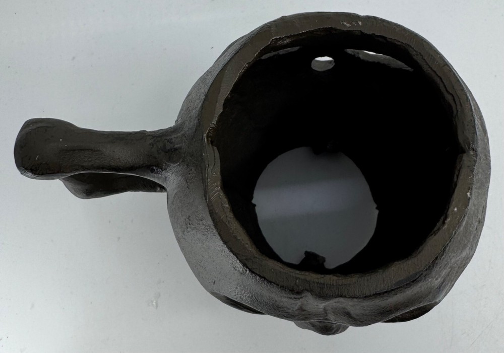 Cast Iron Skull-Shaped Bottomless Mug Thingy With Handle Both Ends And Eyes Open