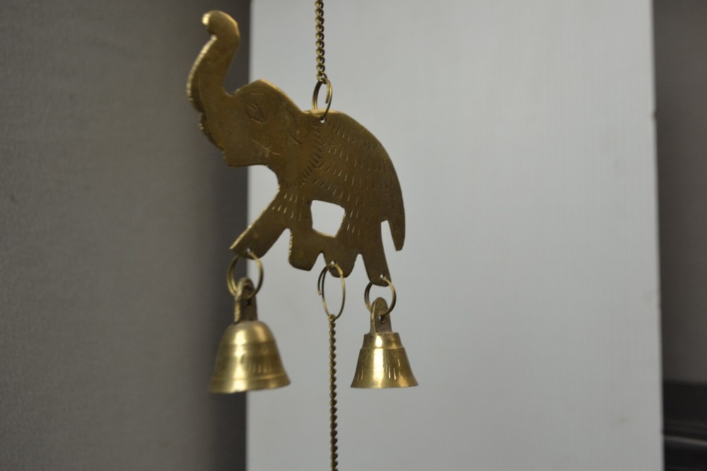 Brass elephants hanging chime with bells