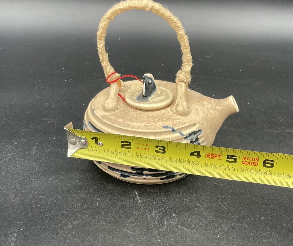 Small Tea Pot Blue & White Pottery w/ Yarn Handle.