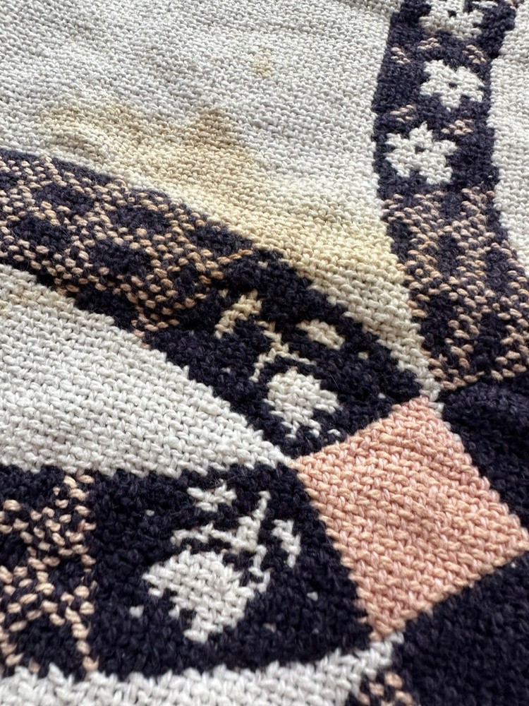 Woven Double Wedding Ring pattern blanket with fringe.