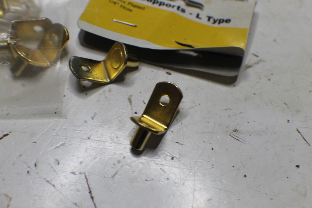 12 1/2" ~ L shaped shelf supports 1/4" hole