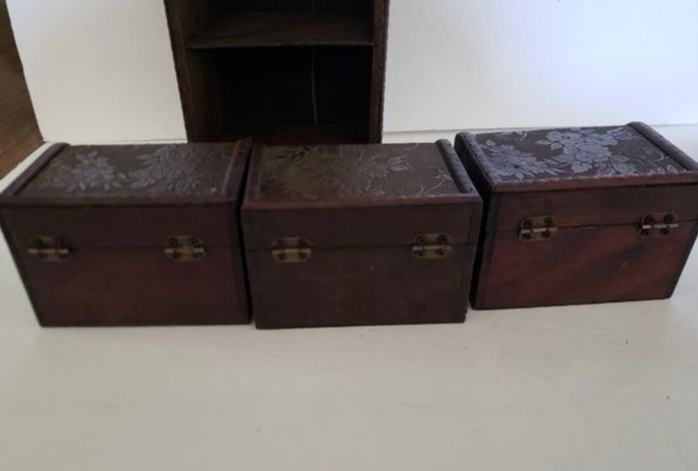 3 Small Storage Trunks in Shelving Unit