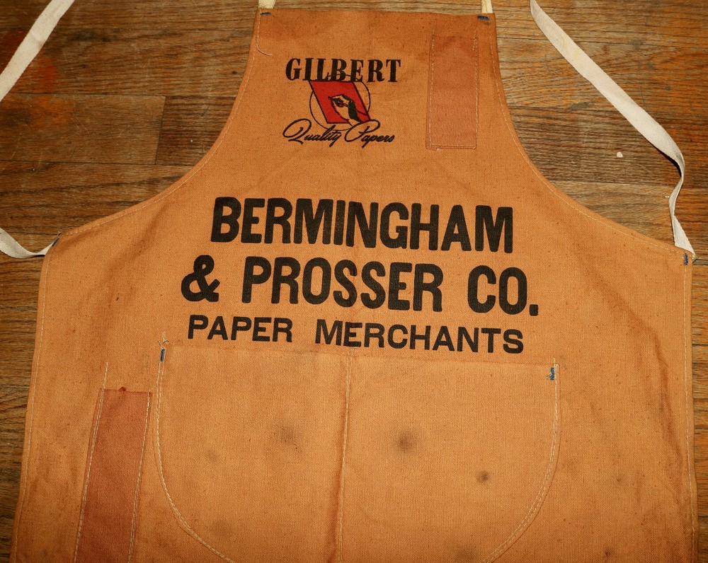 Gilbert Quality Papers advertising work apron