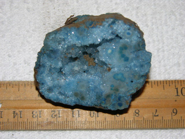 Geode cut & polished half with colored crystal center 2 inch E42