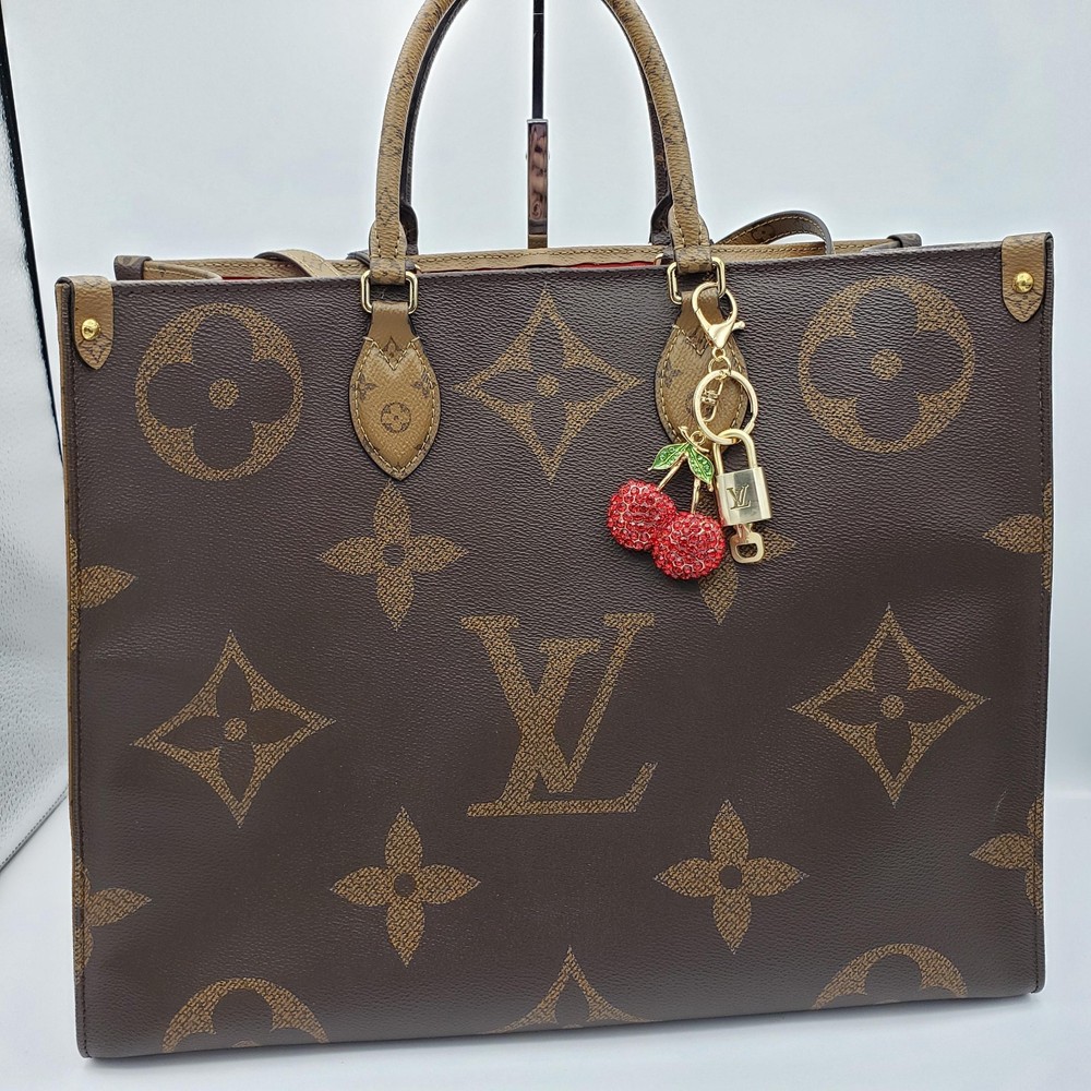 Authentic Louis Vuitton Lock & Key with Unbranded Fruit Charm, Keychain