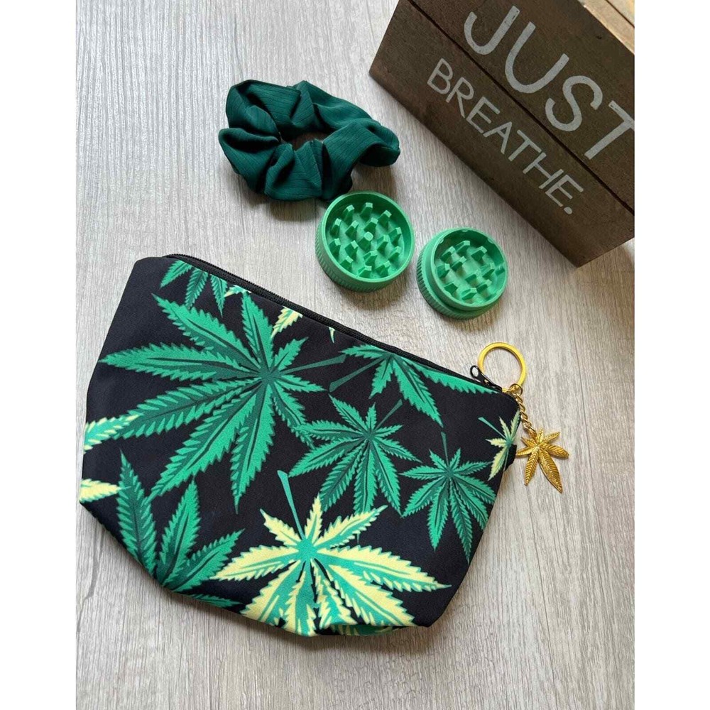 Leaf cosmetic bag with keychain and scrunchie.
