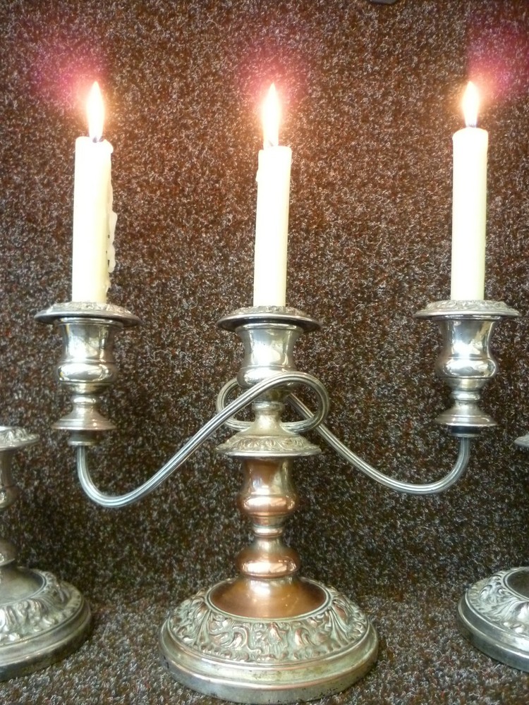 THREE VICTORIAN SILVER ON COPPER CANDLESTICKS, TWO STICKS AND ONE CANDELABRA