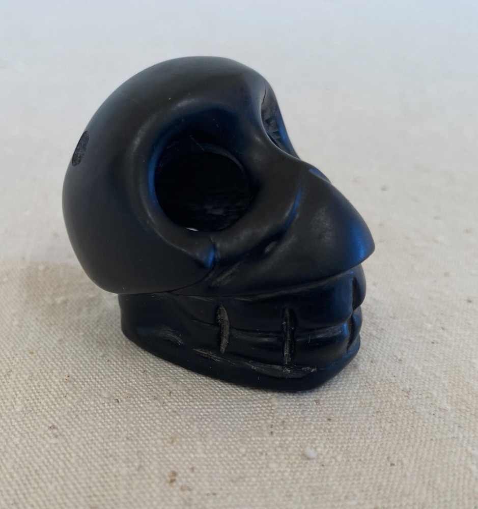 Stylized Carved Stone Skull Pendant