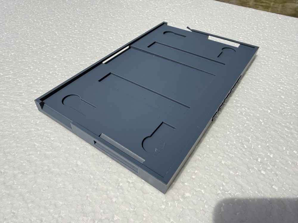 Tin cat mouse trap base protector.