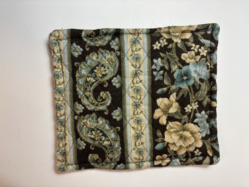 7 Potholders And Mittens In A Basket