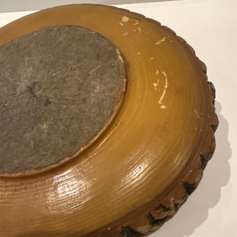 Vintage wooden nut bowl with rustic tree bark,