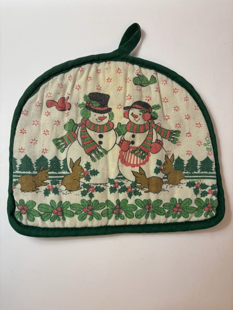 7 Potholders And Mittens In A Basket