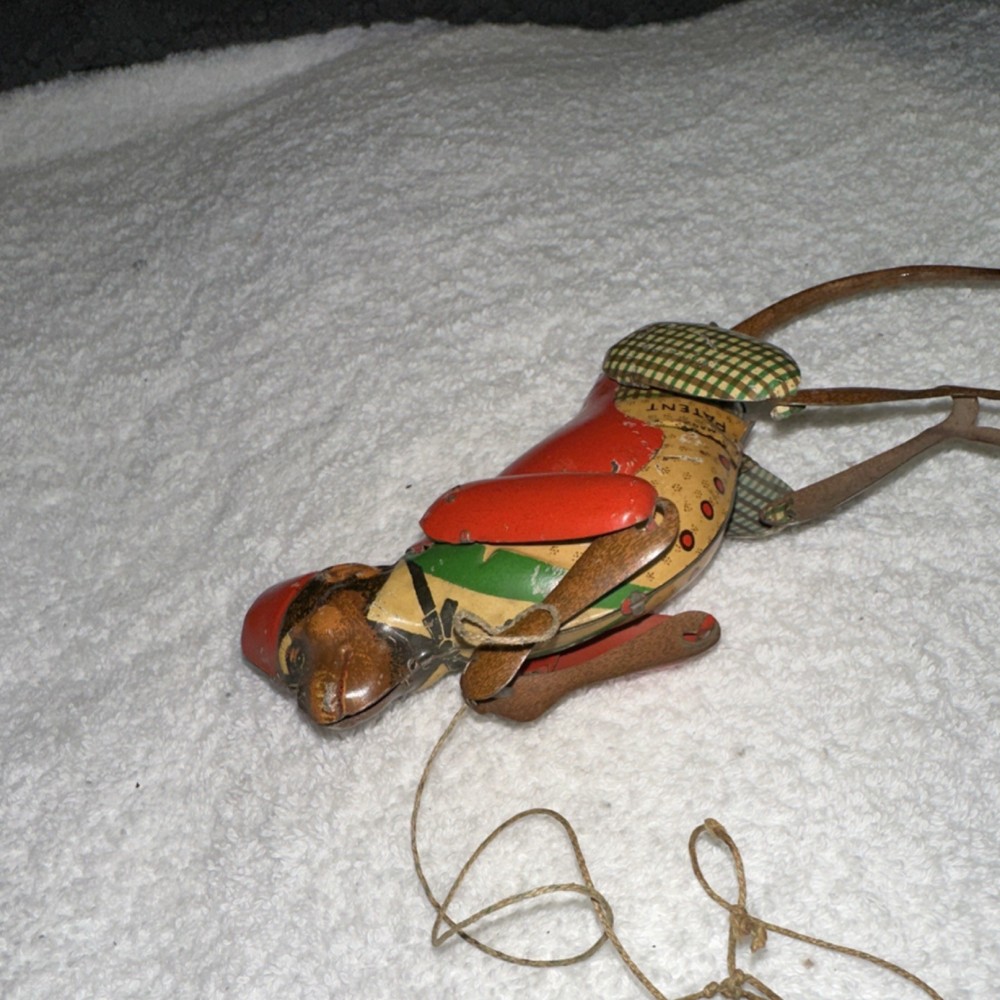 TOM Vintage Tin Monkey Pull Toy Red Jacket