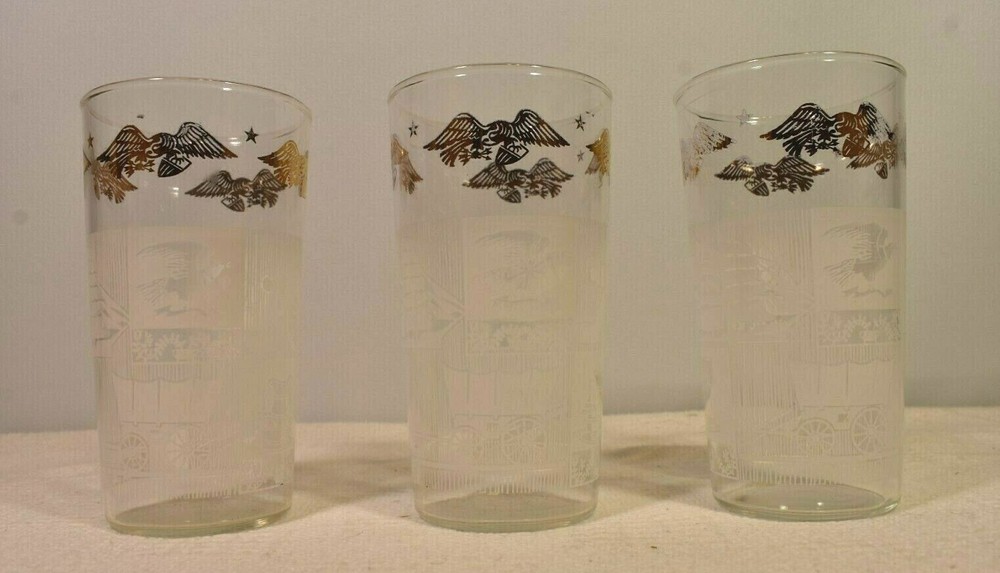 American Heritage VTG Clear Drinking Glasses Gold Eagle Ship Cannon Plow Bell +