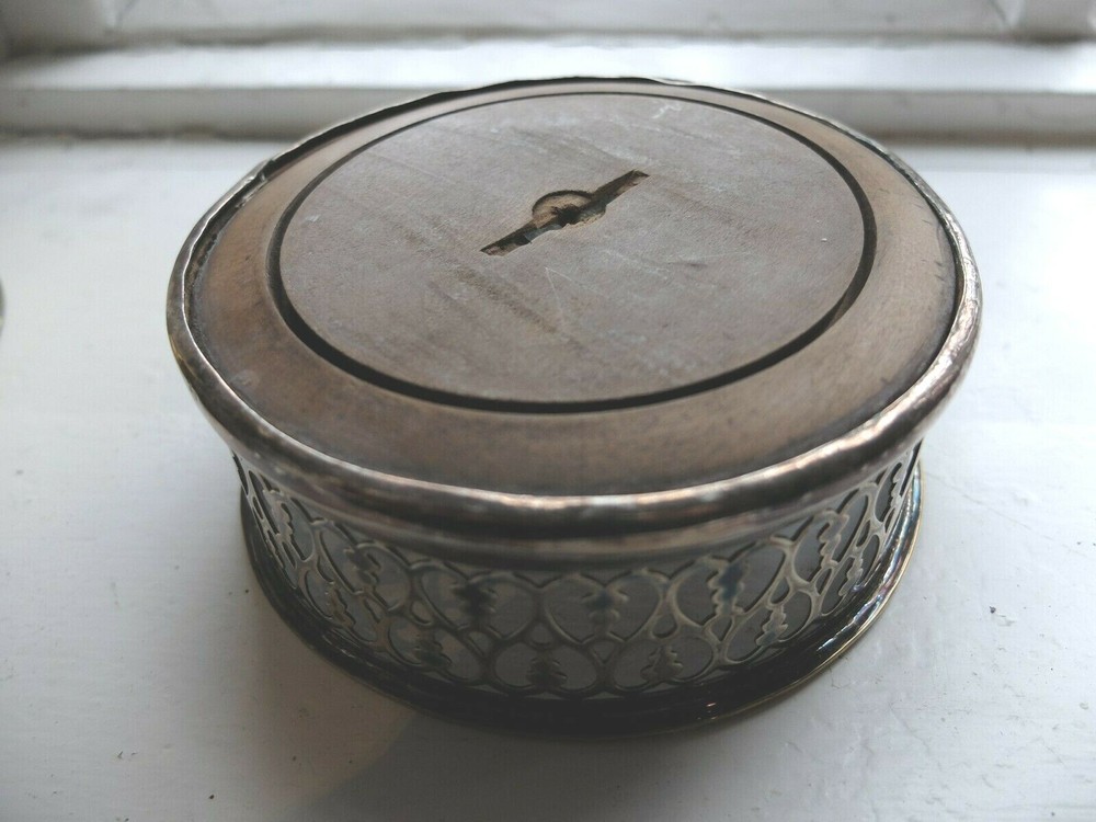 19th century silver plated wine coaster on turned wood base Henry Wilkinson & Co
