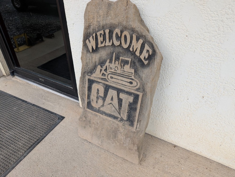 Concrete Caterpillar Welcome Sign
