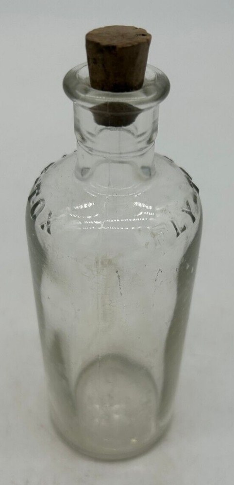 Clear small Fly Tox bottle with cork