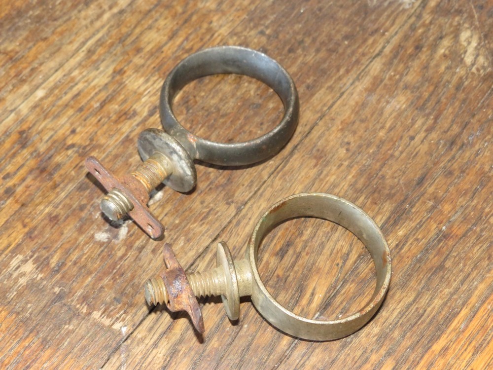 Two Antique Primitive Metal Ring Band Pipe Brackets
