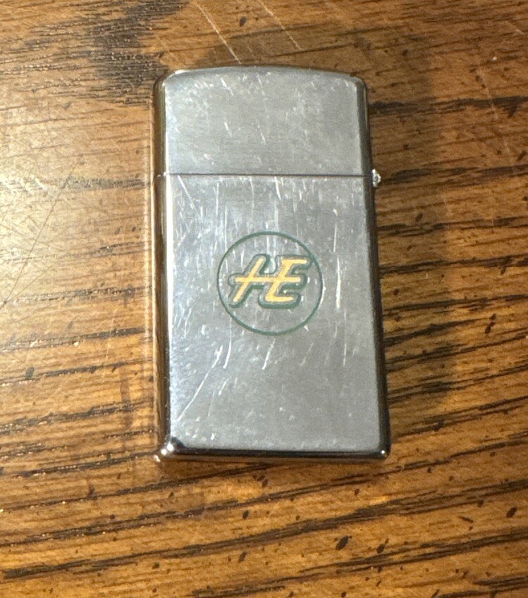 1970 Zippo Slim Lighter “HE” “HYRE”