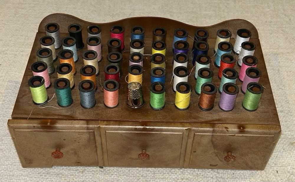 Vintage 1960s plastic sewing caddy 50 spool holders and 49 mini spools  Thimble