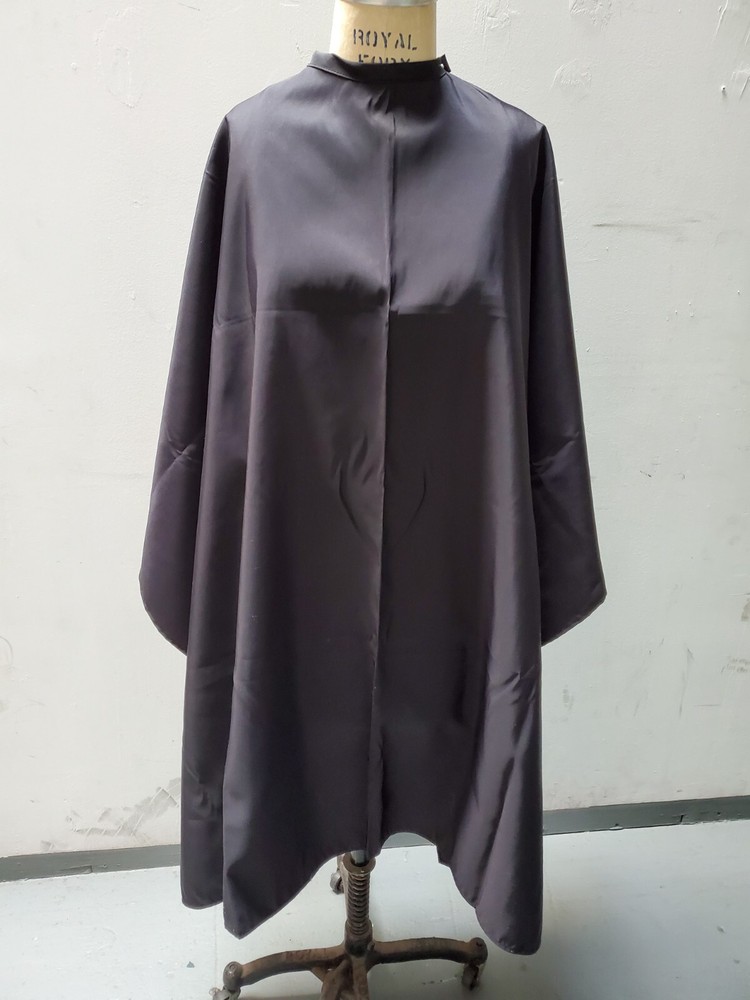 Black Chemical and cutting cape with snap closure
