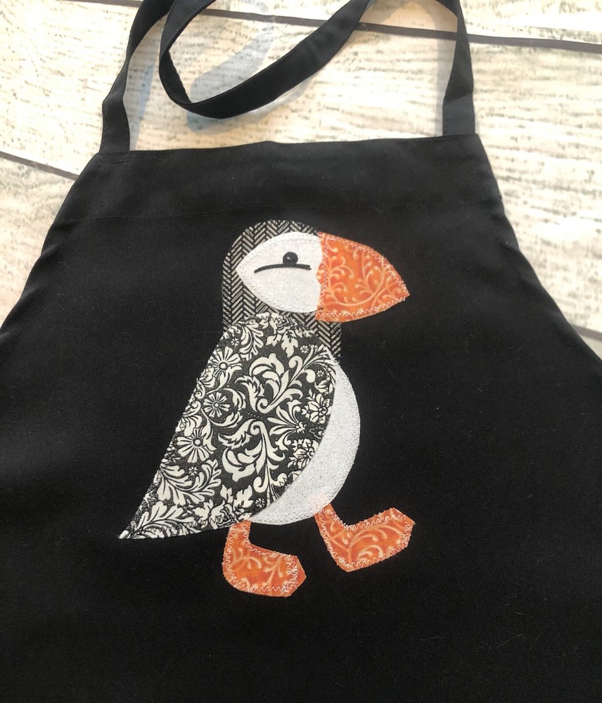 Apron With appliqué puffin.