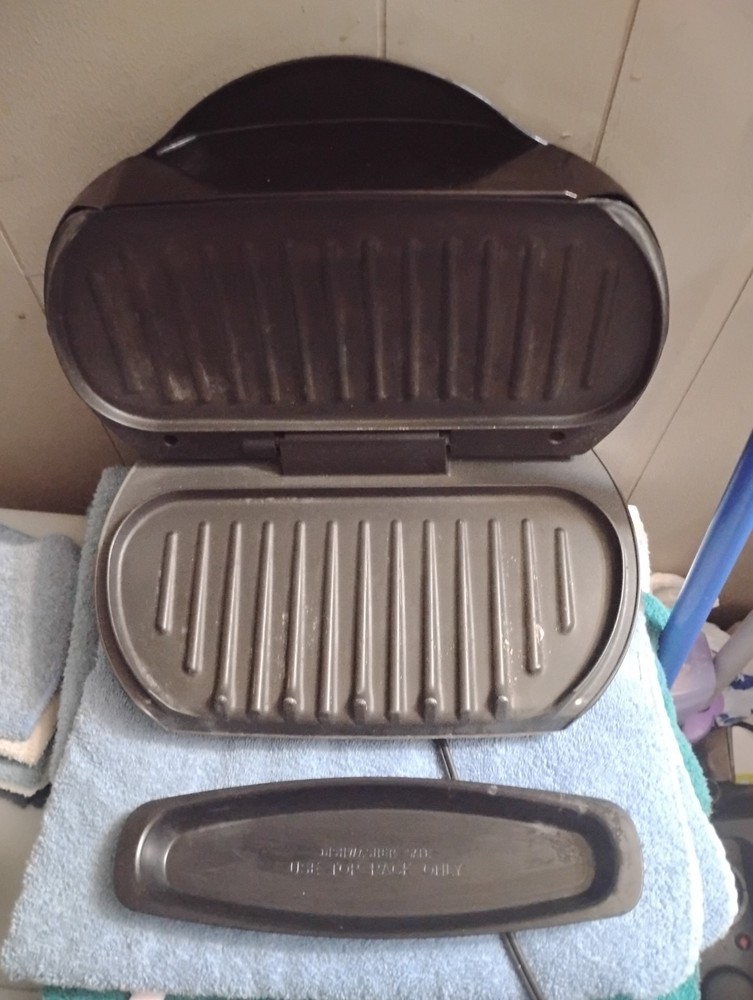 black george foreman grill with drip tray used