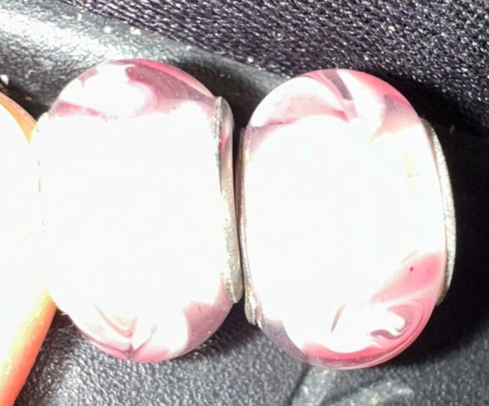 two matching pink patterned charms For Charm Braeclets