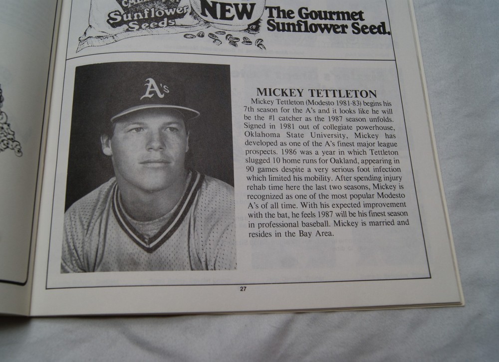 1987 modesto a's official souvenir program writing on cover