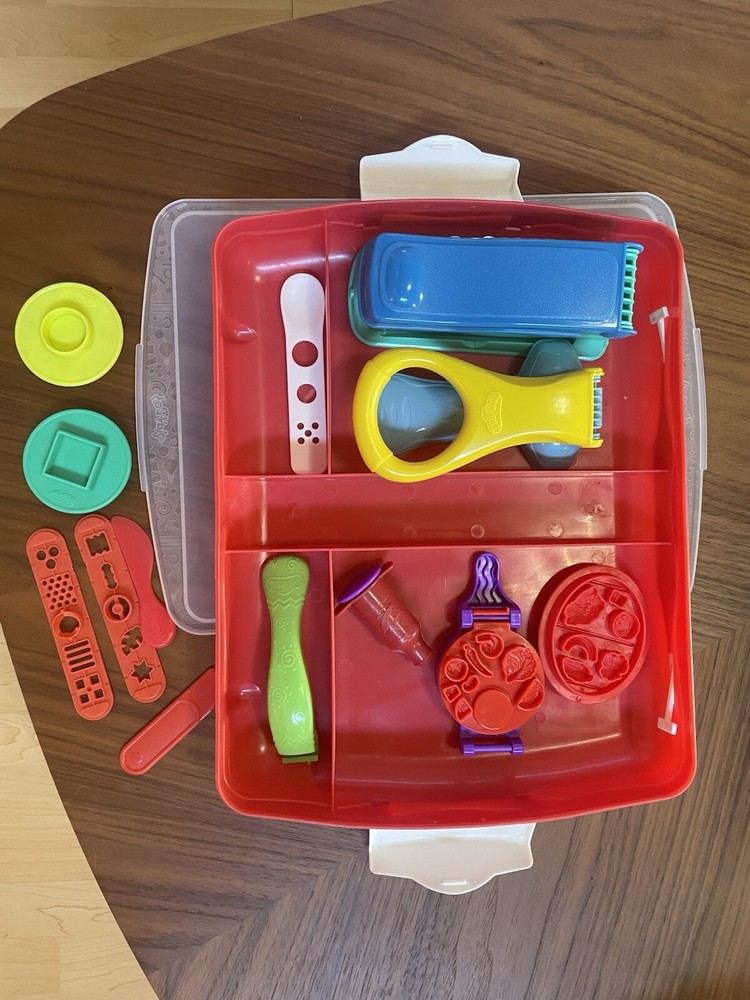 Random Play-Doh accessories including container