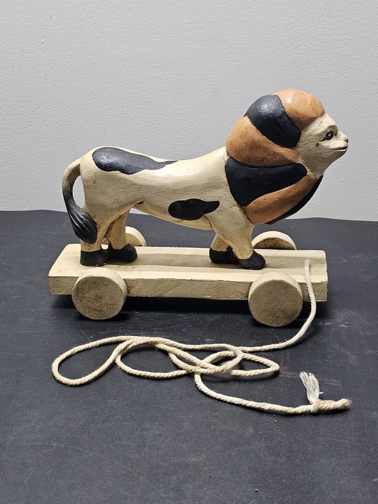 Antique Lion pull toy on wooden platform