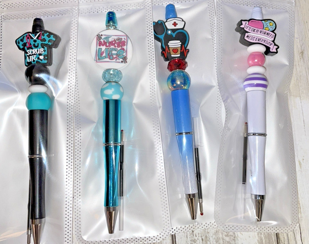 4 miscellaneous  beaded pens with 1   ink refill each