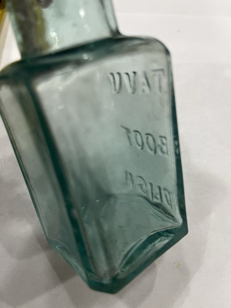 Embossed Aqua Kavu Boot Polish Bottle