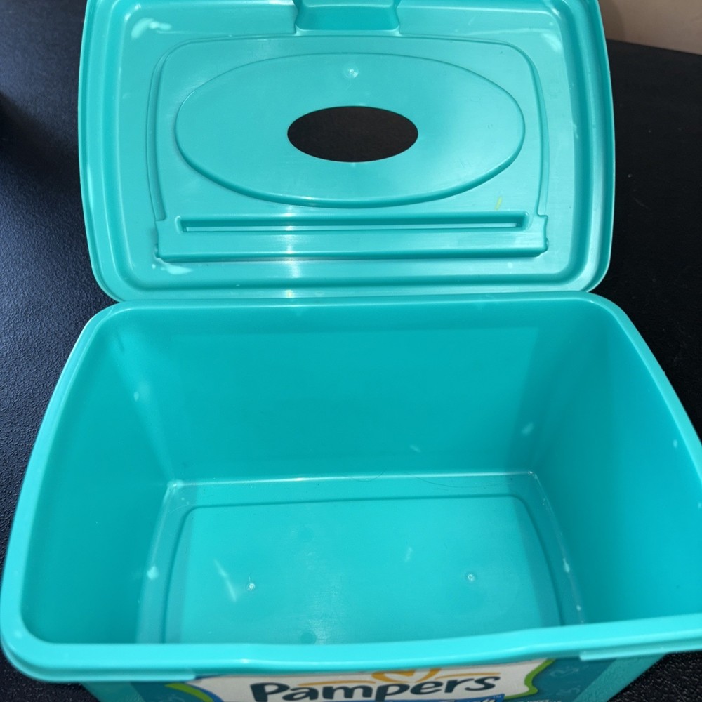 Empty Green Pampers Baby Wipes Container