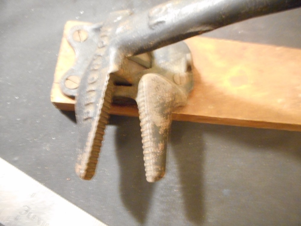 antique Brighton cast iron spring loaded nut cracker marked 10