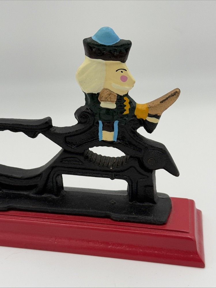 Vintage Cast Iron Nutcracker w/ Hand-Painted Nutcracker Soldier on Red Base