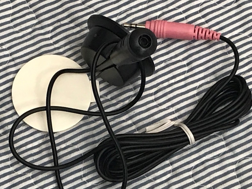 Mini microphone attachable to wall or desk