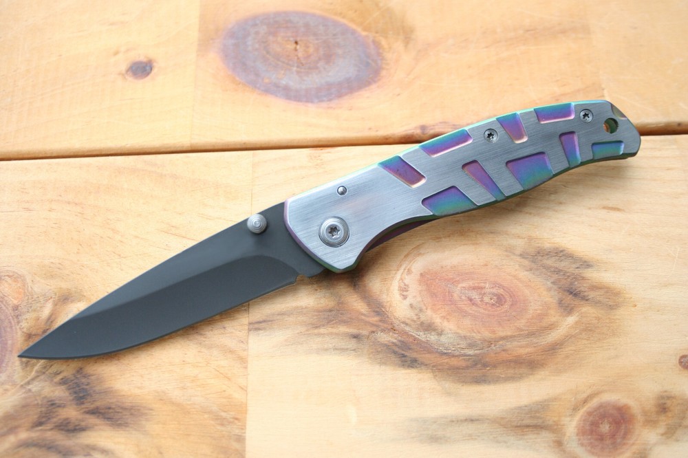 Gentleman frame lock folding knife with rainbow anodized handle. 17.6 cm overall