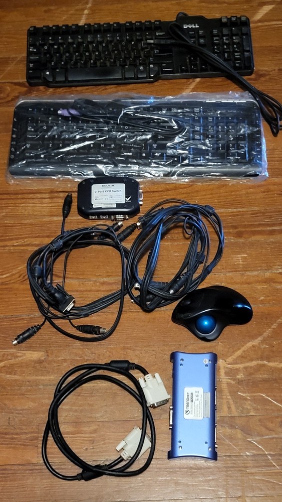2 KVM, cables, trackball, 2 keyboards