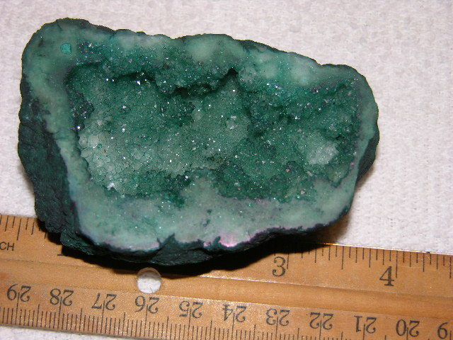 Geode cut & polished half with colored crystal center 3.5 inch E80