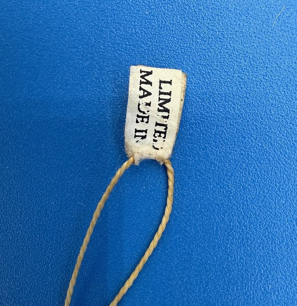 PAINTED METAL "JUMPING JILL" PULL STRING TOY FIGURE