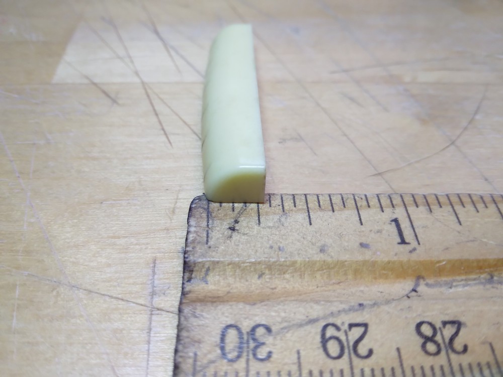 Vintage unbranded Plastic guitar Nut, white