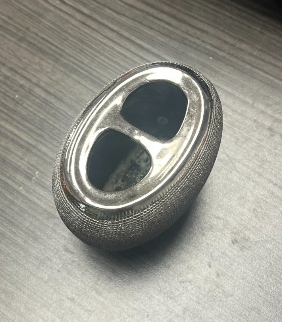 Silver and black tooth brush holder