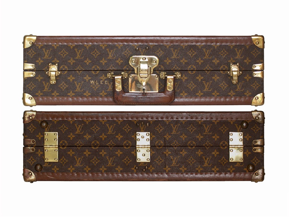 Louis Vuitton monogram suitcase trunk open by center, square handle.