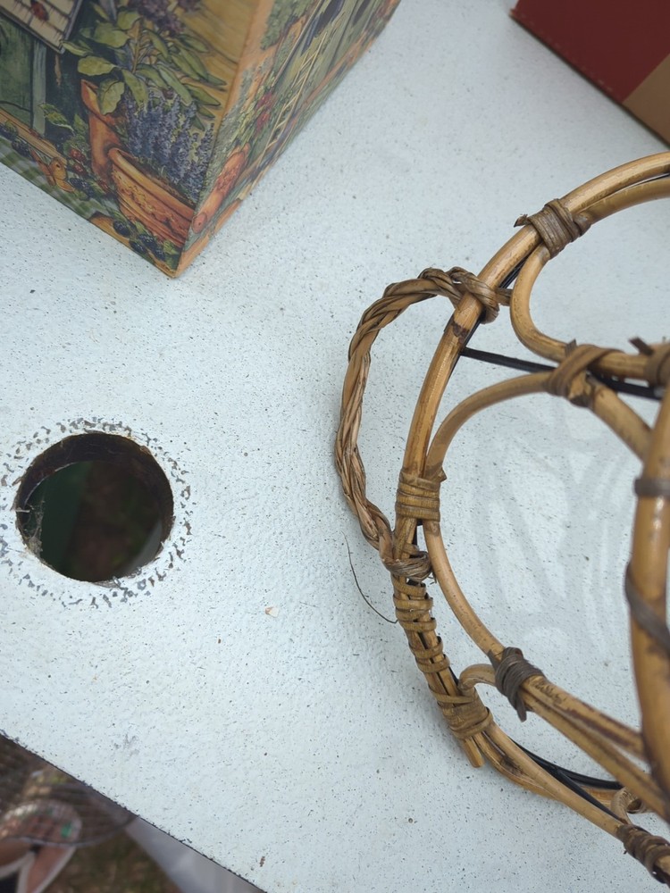 boho chic bamboo or rattan wastebasket or planter featuring earthy textures.