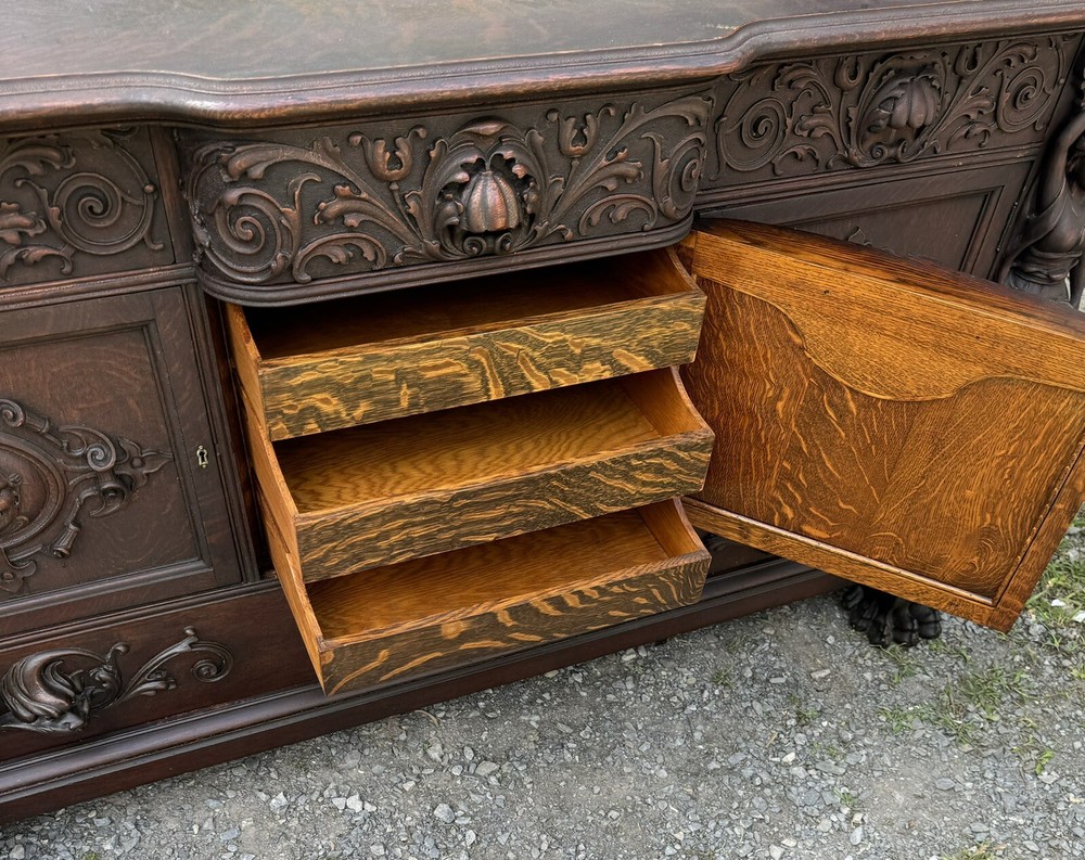 A. J. JOHNSON CARVED FIGURAL OAK SIDEBOARD