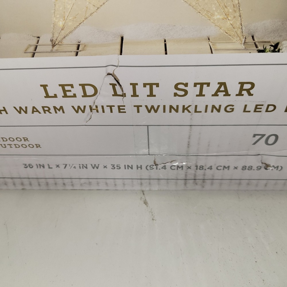 Lit LED Hanging Star Window Decor with 70 Warm White Bulbs