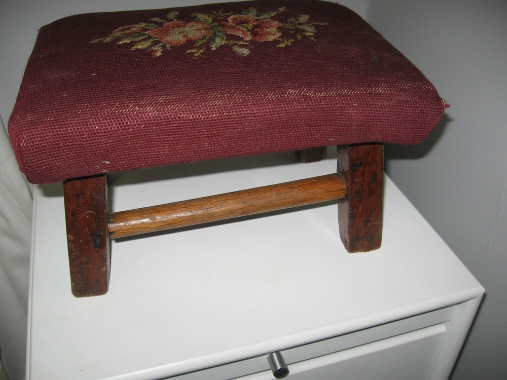 antique wood 4 legged foot stool with needlework top